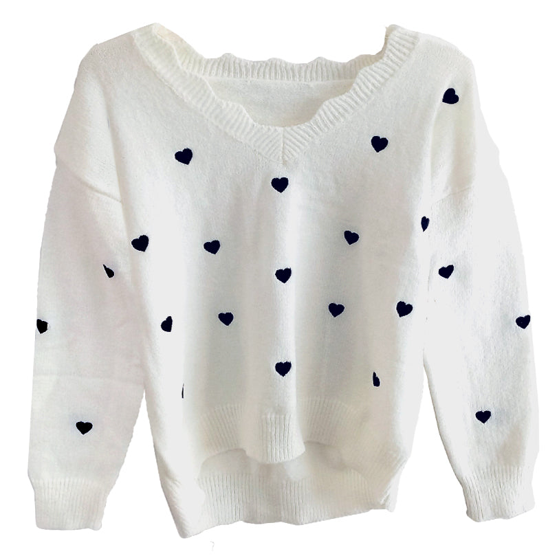 Suéter hueso con corazones negros