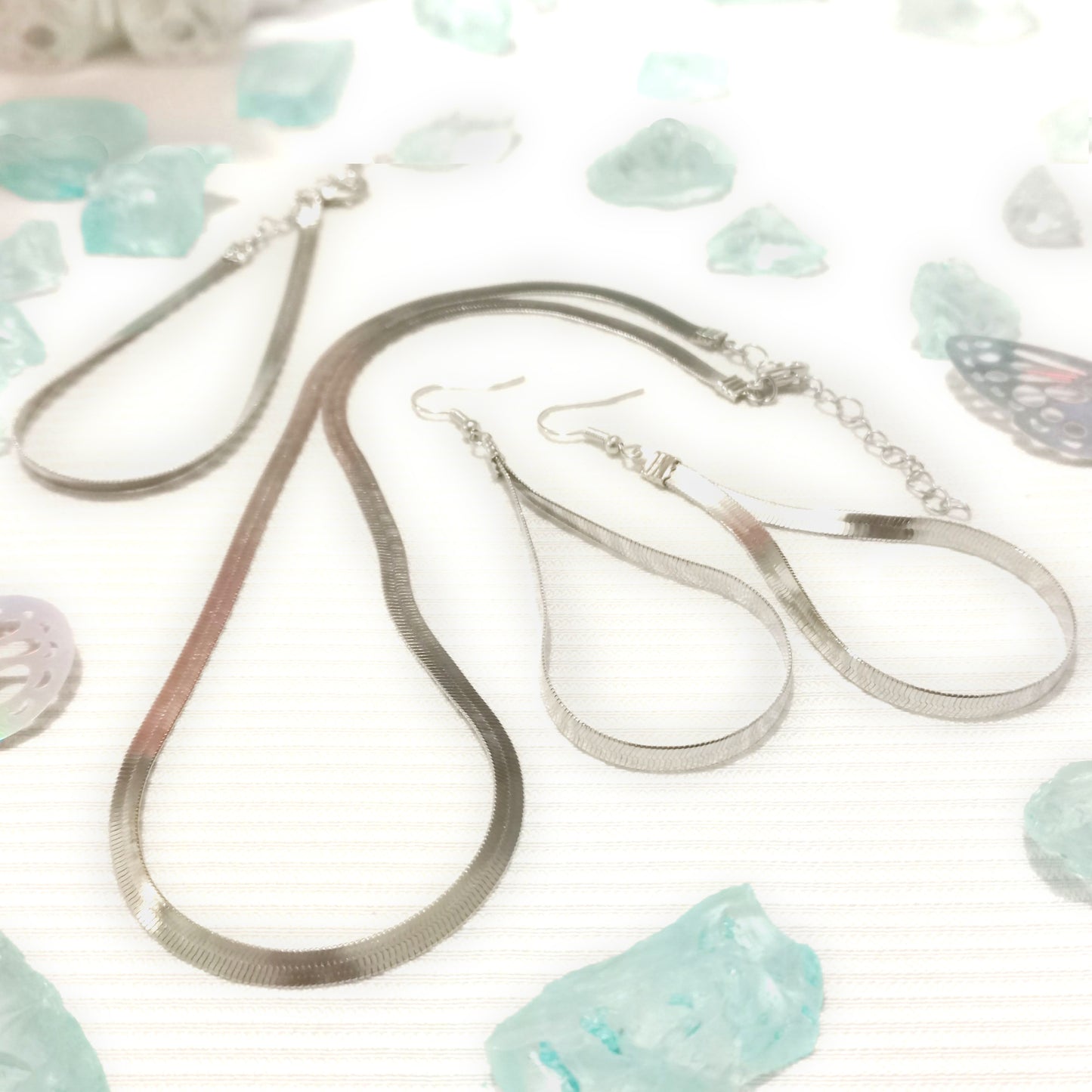 Juego de collar, pulsera y aretes brisas color plata