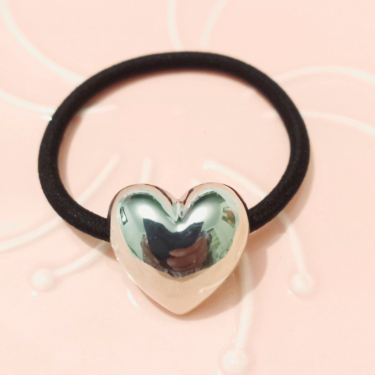 Sujetador de cabello corazón plateado